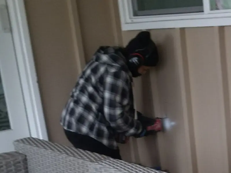 Professional electrician installing an exterior outlet in Campton
