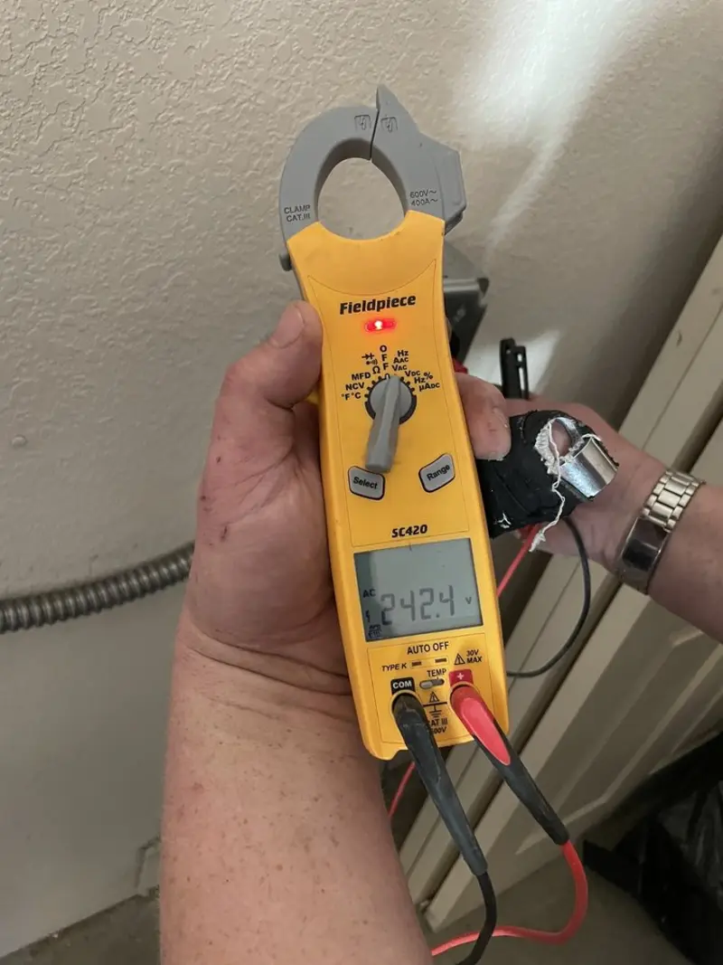 Voltage testing with clamp meter during Aluminum Wiring Replacement in Campton